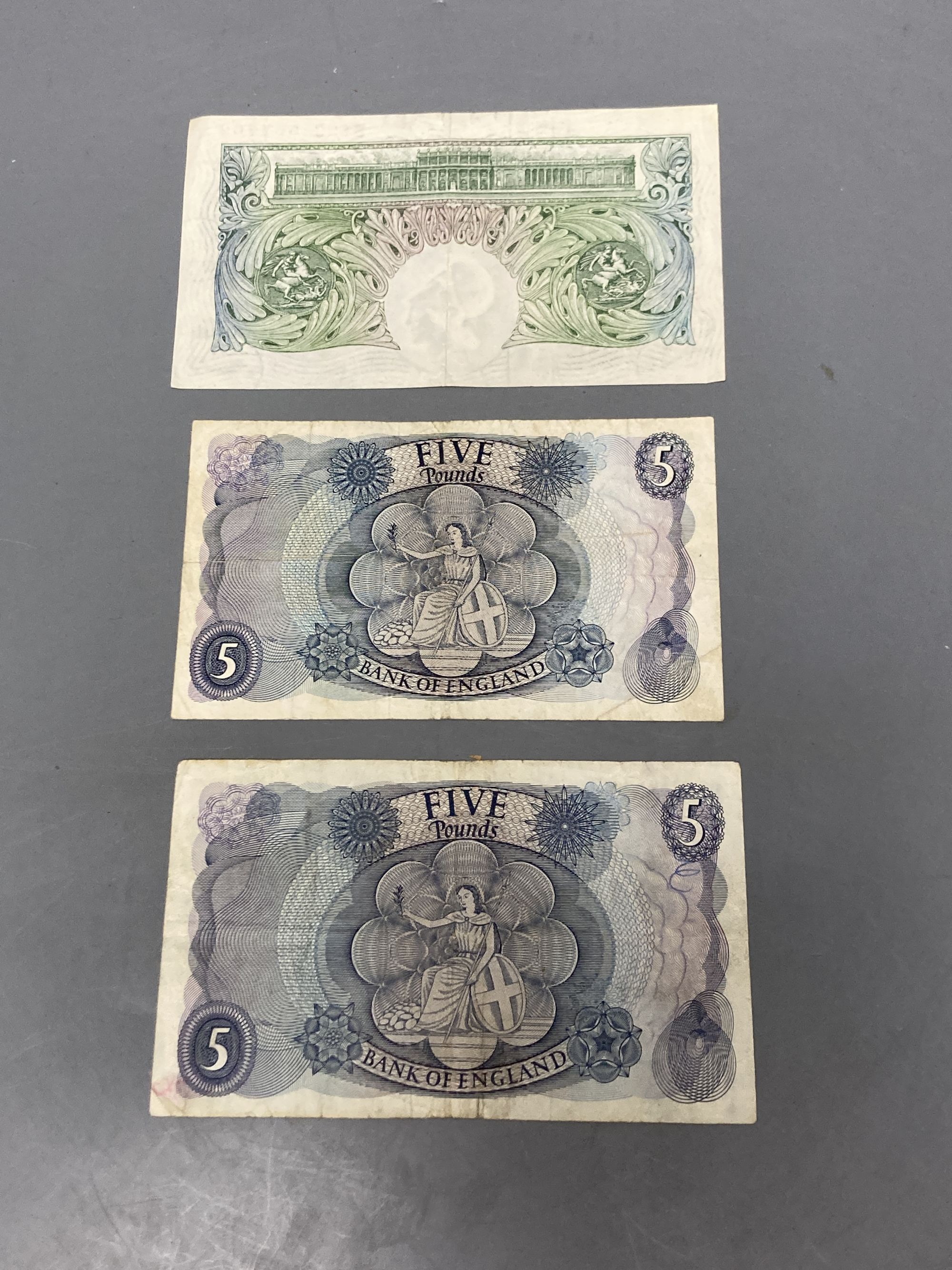 Two £5 notes and one £1 note